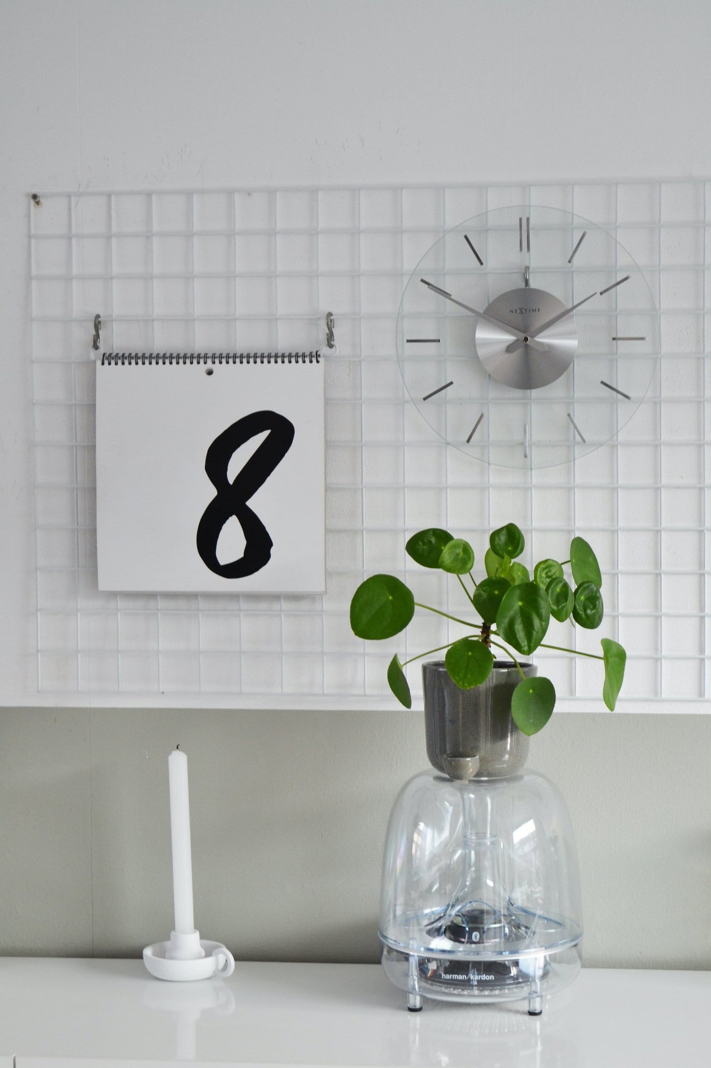 NeXtime Clocks wall clock, 26 cm aluminum and glass, with a modern Stripe design showing black and white stripes on the face.