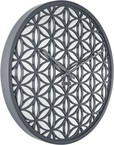 NeXtime Clocks Bella Mirror wall clock with 50cm wooden frame and mirror accents, showing a stylish left side view.