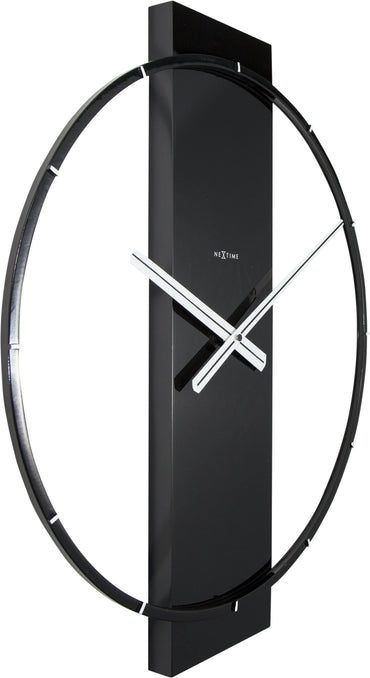 NeXtime wall clock with wood and steel design, showing a left side view of the 50.8 x 58.2 cm clock on a wall.