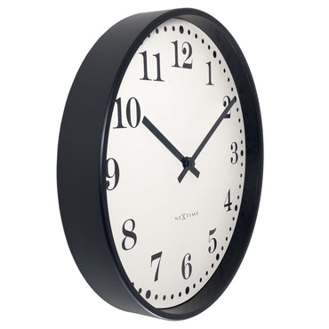 NeXtime Dickens wall clock, 30cm diameter, black and white plastic design, silent movement, shown from left side.