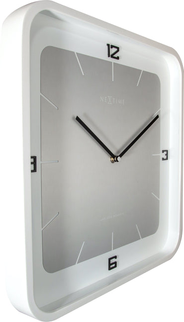 Square NeXtime wall clock, 40x40 cm, wooden frame, showing a modern design with black clock hands and minimalist style.