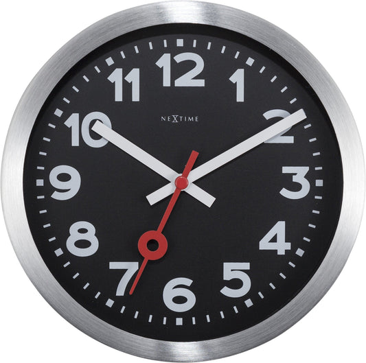 NeXtime Clocks black aluminum station numbers wall or table clock with modern design and clear time display.