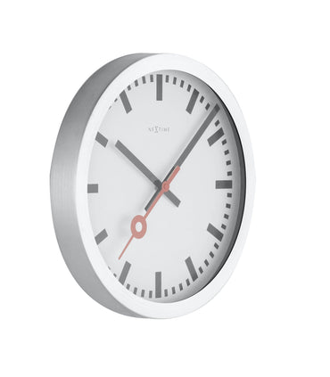 NeXtime Clocks Station Stripe aluminum wall or table clock showing a sleek, modern design with black and white striped pattern.