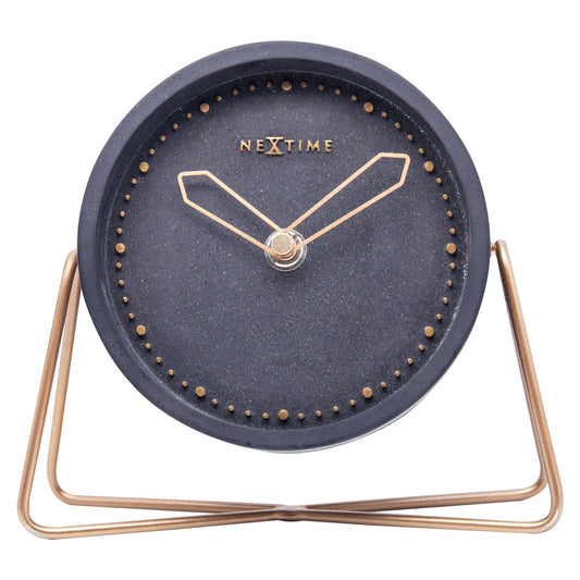 NeXtime Clocks table clock made of polyresin, 17.5 x 15.5 x 5 cm, with a front view showcasing its decorative design.