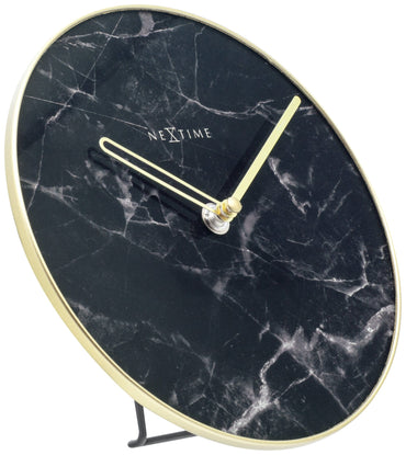 NeXtime marble table clock, 20 cm with glass and metal design, displayed on a table with a left side view.