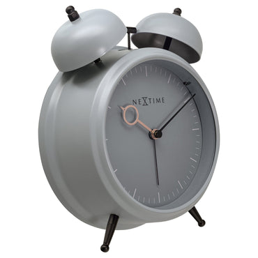 NeXtime Golden Hour metal alarm clock showing a sleek design with light function, silent operation, and dimensions 15x18x7cm.