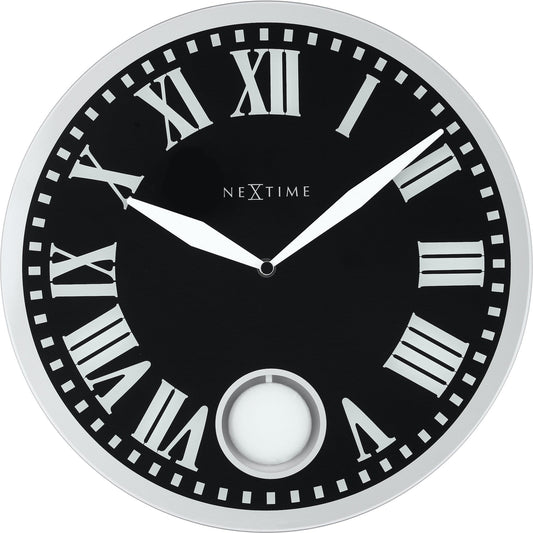 NeXtime Clocks Romana wall clock, 43x4.2 cm with glass face, modern design, black hour and minute hands, white dial.