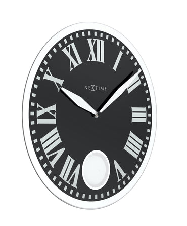 NeXtime Clocks Romana wall clock with glass face, 43x4.2 cm, showing a close-up of the clock's left side and elegant design.