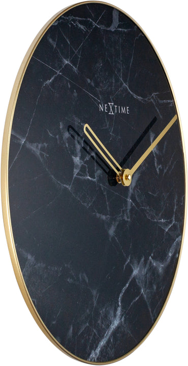 NeXtime Clocks wall clock with 40cm marble glass and metal frame, showing a sleek modern design on a light background.
