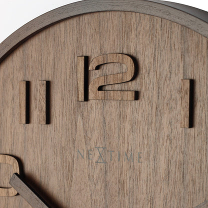NeXtime Wood Wood Medium wall clock with 35cm wooden face, detailed close-up showing natural wood grain and modern design.