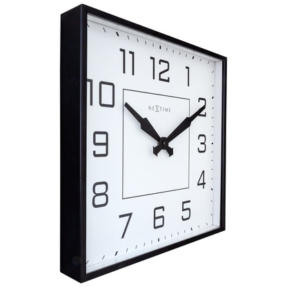 NeXtime Clocks Be Square wall clock, 35x35cm, silent metal design with Arabic numerals, shown from left side.