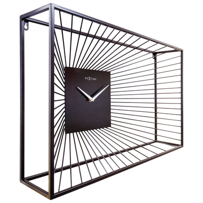 Large black metal NeXtime Vasco wall clock, 70x45x15cm, with silent movement, shown from the left side.