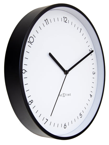 NeXtime Berlin wall clock, 30cm silent aluminium clock with black hands, shown from the left side.