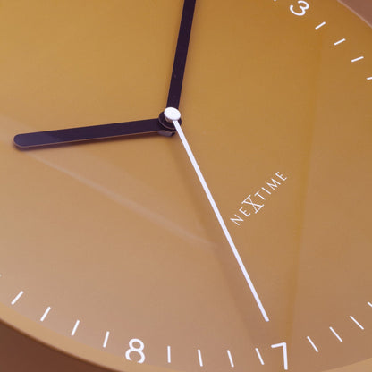 NeXtime Clocks Berlin wall clock, 30cm, silent aluminium design with black hands and minimalist style, mounted on a wall.