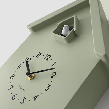 NeXtime Twitter wall clock with pendulum, cuckoo feature, measuring 21.5x41.5x8.5cm, showcasing detailed design and craftsmanship.