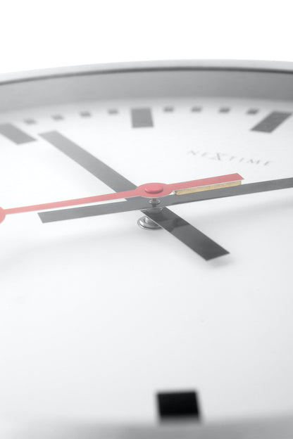 NeXtime Clocks Station Stripe aluminum wall or table clock with modern design and detailed clock face.