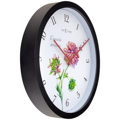 Weatherproof outdoor garden clock by NeXtime, 30.5 cm diameter, showing a stylish Knautia design on a garden wall.