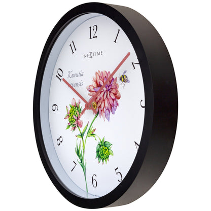 Weatherproof outdoor garden clock by NeXtime Clocks, 30.5 cm diameter, showing a stylish Knautia design on the right side.