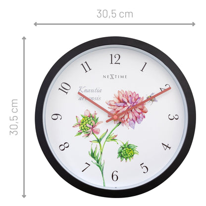 Weatherproof outdoor garden clock by NeXtime Clocks, 30.5 cm diameter, featuring a stylish Knautia design for outdoor spaces.