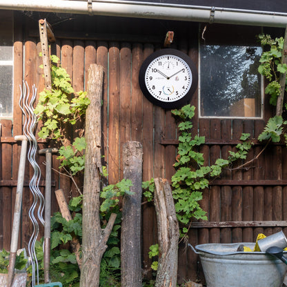 NeXtime Clocks weatherproof garden wall clock with Daisy design, 25.5 cm diameter, ideal for outdoor weather monitoring.