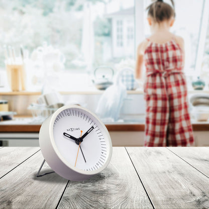 Small NeXtime Clocks metal table alarm clock with silent operation and built-in light function, measuring 9x9x7.5cm.