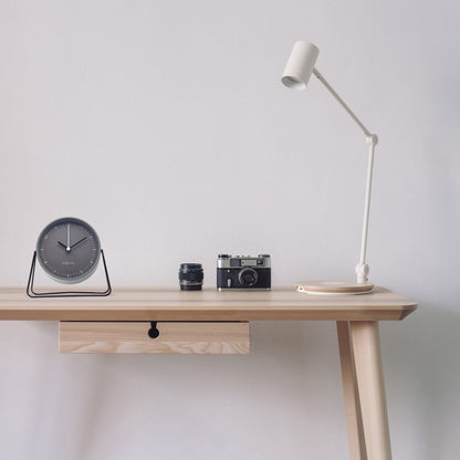 NeXtime metal Berlin table alarm clock, 14x13x7cm, silent design with modern metal finish, placed on a wooden surface.