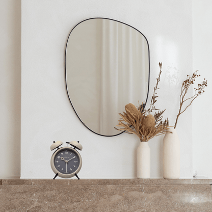 NeXtime Golden Hour metal alarm clock, 12x14x6cm, with a stylish design and gold finish, displayed on a wooden surface.