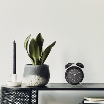 NeXtime Golden Hour alarm clock with metal frame, 12x14x6cm, featuring a stylish design and clear clock face.