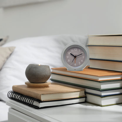 NeXtime Circle alarm clock with silent light dial, 10.5cm x 3.6cm tabletop design, in a sleek modern style.