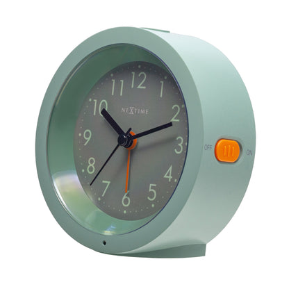 NeXtime Circle alarm clock with silent light dial, 10.5cm x 3.6cm, showing the right-side view with modern design.