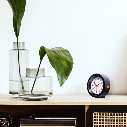 NeXtime Circle alarm clock with silent light dial, 10.5cm x 3.6cm, tabletop design, black and white face, modern style.