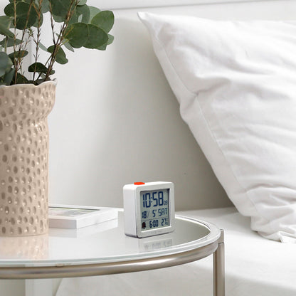 Mini digital table alarm clock by NeXtime Clocks with metal and ABS construction, measuring 6x6.4x2.1cm.