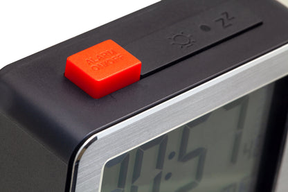 Mini digital alarm clock by NeXtime with metal and ABS construction, displaying time on a compact 6x6.4x2.1cm device.