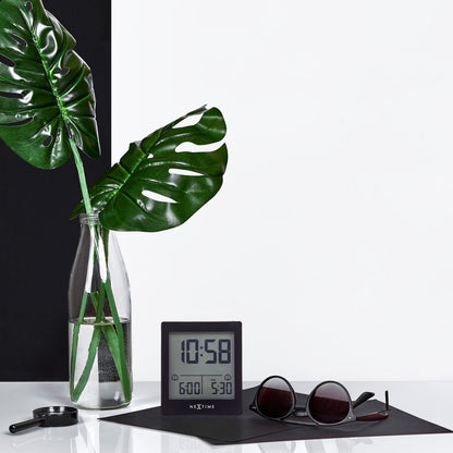 NeXtime digital alarm clock with LED display, compact size 7.7x8.9x3cm, in a sleek black design for bedside use