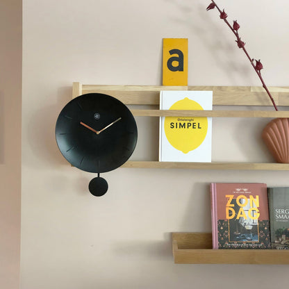 NeXtime Clocks 30 cm plastic wall clock with a modern bowl design, featuring a sleek and minimalist appearance.
