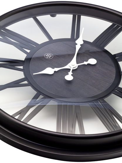 Close-up of a 51 cm plastic wall clock by NeXtime Clocks with a Quebec-themed design, showing the clock face and hands.