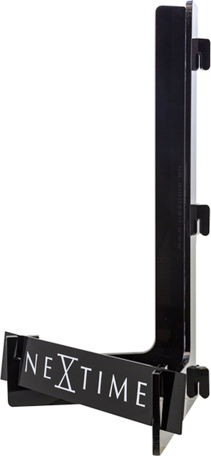 Acrylic display clock by NeXtime Clocks, 28x18x12 cm, showing a sleek modern design from the right side.
