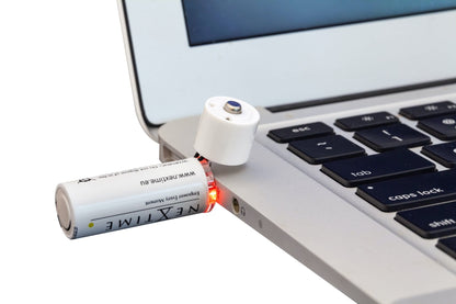 Pair of NeXtime Clocks USB AA batteries, showing the detailed close-up of the battery terminals and branding.