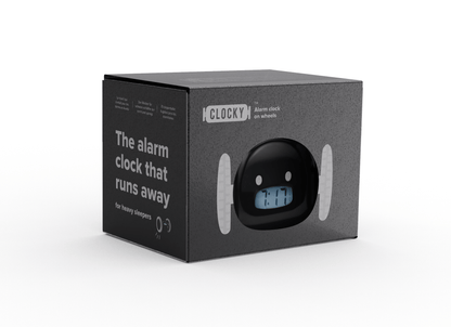 Black Clocky alarm clock on wheels by NeXtime Clocks, showing its compact design and rolling feature from an angled view.