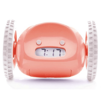 Pink NeXtime Clocks Clocky alarm clock on wheels with digital display and snooze button, designed to wake you up with movement.