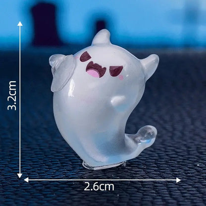 Six glow-in-the-dark ghost miniatures from Florazo NL, 2.5 to 3.5 cm tall, shown on a white background.