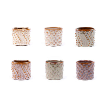 Set of six small ceramic pots from Florazo NL's Madrid Mini Pot Set, with colorful finishes and compact design.