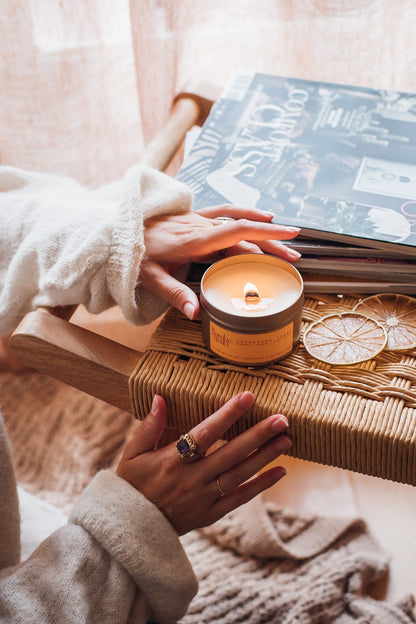 Flambé Fleuri Champagne Toast Candle in a decorative tin, featuring a festive design and warm glow for celebratory ambiance.